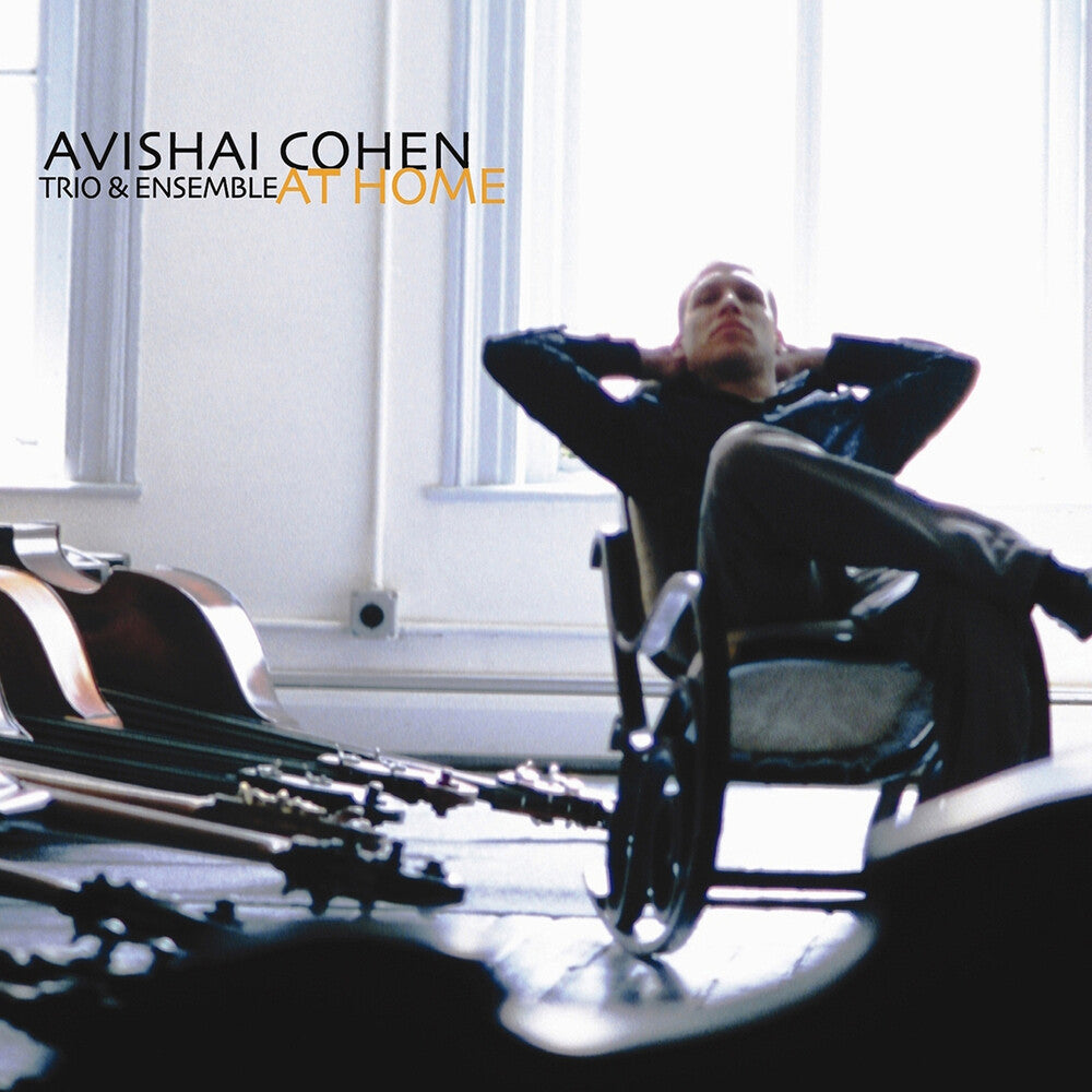 the album cover for Avishai Cohen / Guiliana,Mark / Tzur,Tomer - At Home