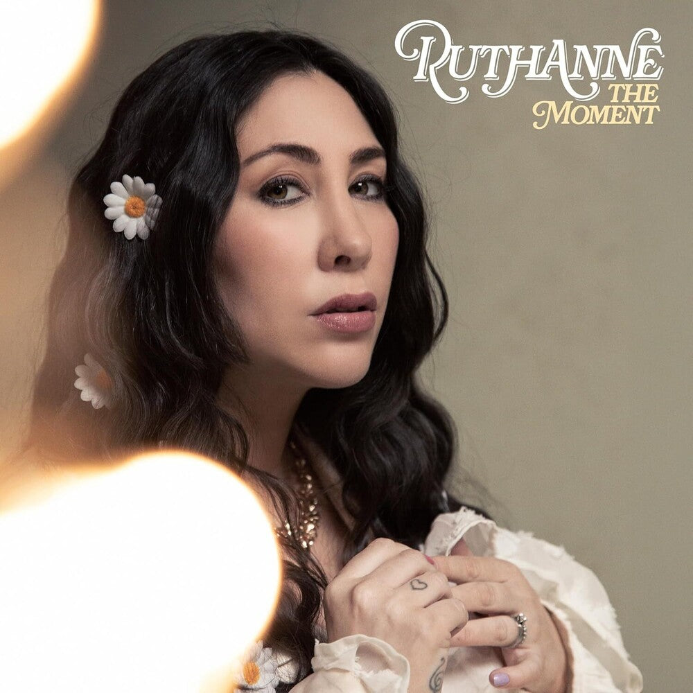 the album cover for Ruthanne - Moment (Uk)