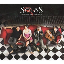 the album cover for Solas - For Love and Laughter