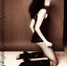 the album cover for Carly Simon - Playing Possum