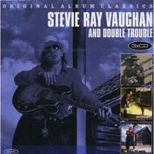 the album cover for Stevie Ray Vaughan - Texas Flood/Couldnt Stand The Weather/Soul To Soul [Import]