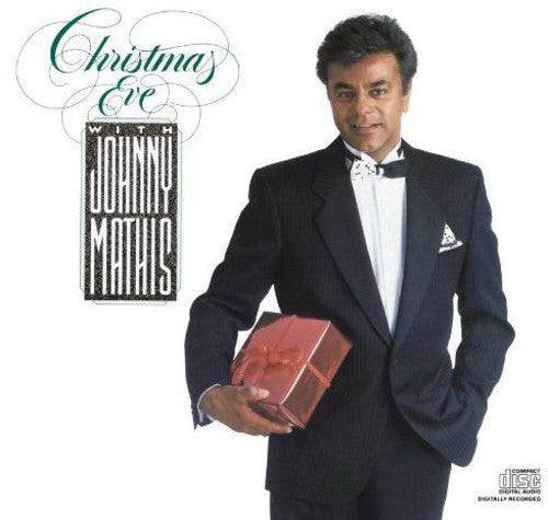 the album cover for Johnny Mathis - Christmas Eve With Johnny Mathis