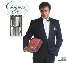 the album cover for Johnny Mathis - Christmas Eve With Johnny Mathis