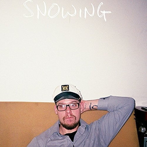 the album cover for Snowing - Time I Sat In A Pile Of Chocolate : A Retrospecti