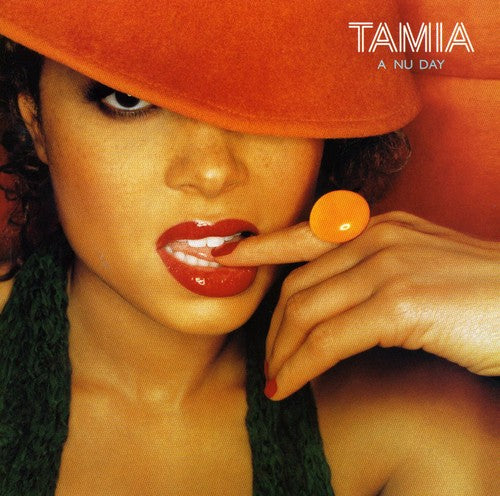 the album cover for Tamia - A Nu Day