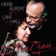 the album cover for Herb Alpert & Lani Hall - I Feel You