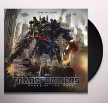 the album cover for Various Artists - Transformers: Dark of The Moon - The Album [Soundtrack LP]