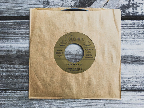 the album cover for Durand Jones & The Indications - You & Me / Put A Smile On Your Face [Vinyl Single]