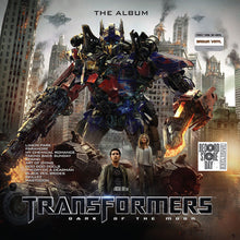 the album cover for Transformers Dark Of The Moon - The Album / Var - Transformers Dark Of The Moon - The Album / Var