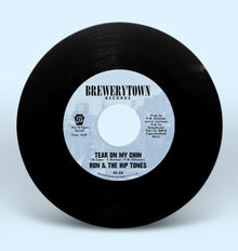 the album cover for Ron & The Hip Tones - Tear On My Chin B/W People (Feat. Ursula Rucker)