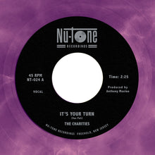the album cover for The Charities - The Charities - It's Your Turn / Strangers [45]