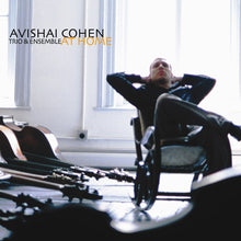 the album cover for Avishai Cohen  / Guiliana,Mark / Tzur,Tomer - At Home