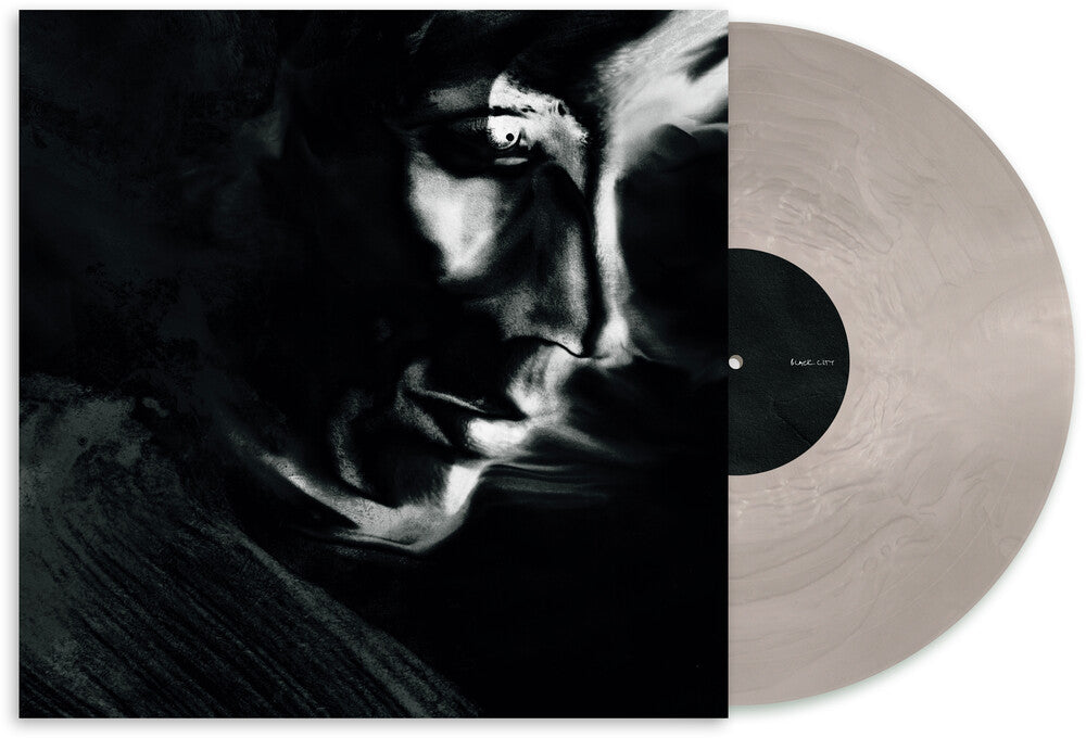 the album cover for Matthew Dear - Black City (Ghostly 25 Year Anniversary Edition) -  [Transparent Silver Vinyl LP]