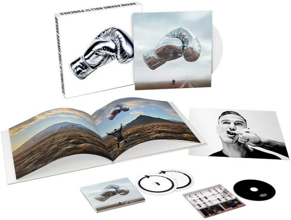 the album cover for Bryan Adams - Roll With The Punches: Deluxe (Box) [Colored Vinyl] [Deluxe]