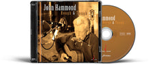 the album cover for John Hammond - Rough & Tough (Hybr)